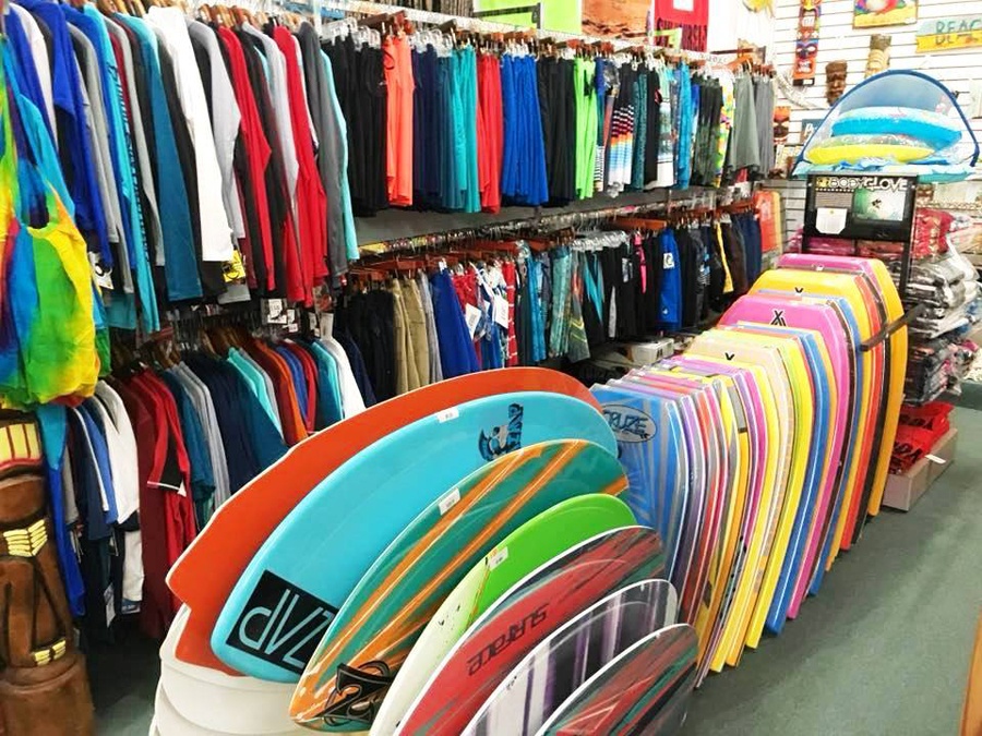 View of wet suites and skim boards for sale 