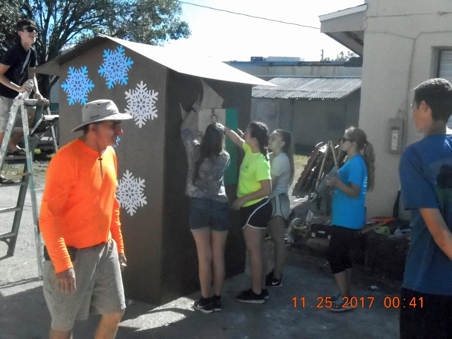 Kiwanis President Richard Schlitt and Key Club Members making Ginger Bread Christmas Float