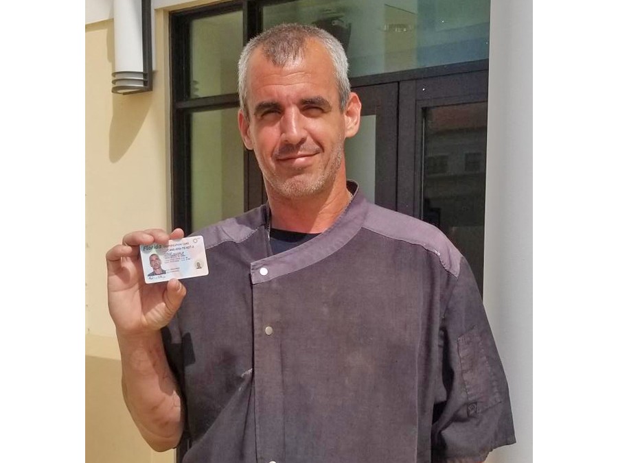 Man showing his drivers license