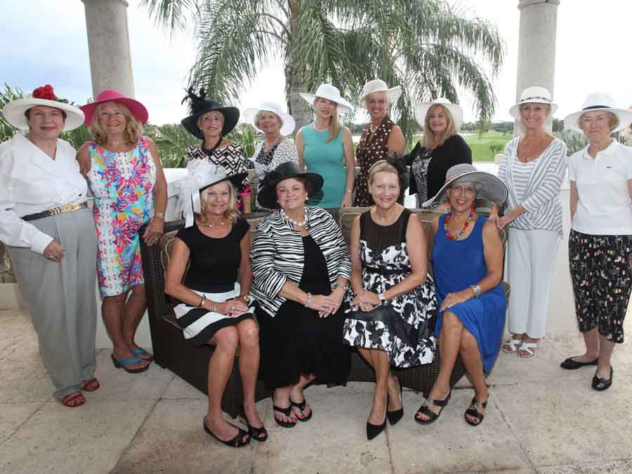 Photo of ladies wearing hats at fundraiser