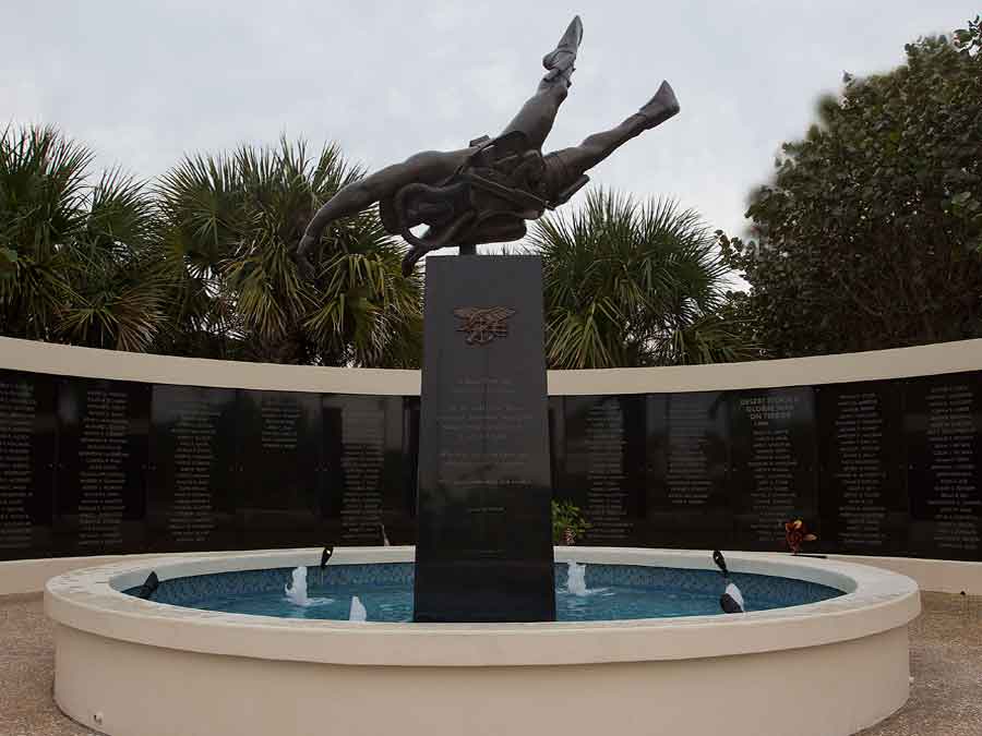 statue of Navy Seal by Memorial Wall